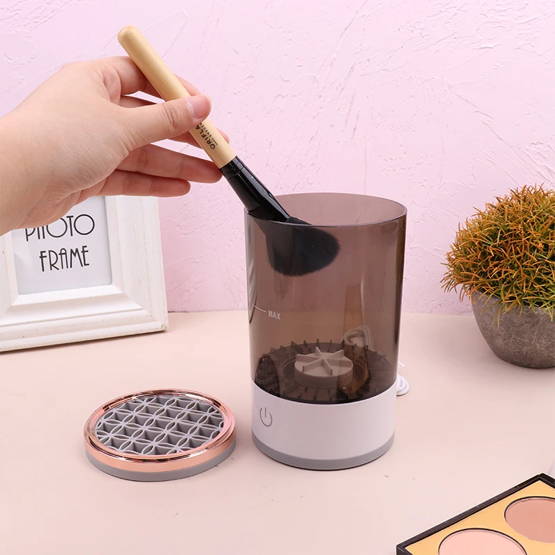 Placing a makeup brush into the Rinsella cleaner